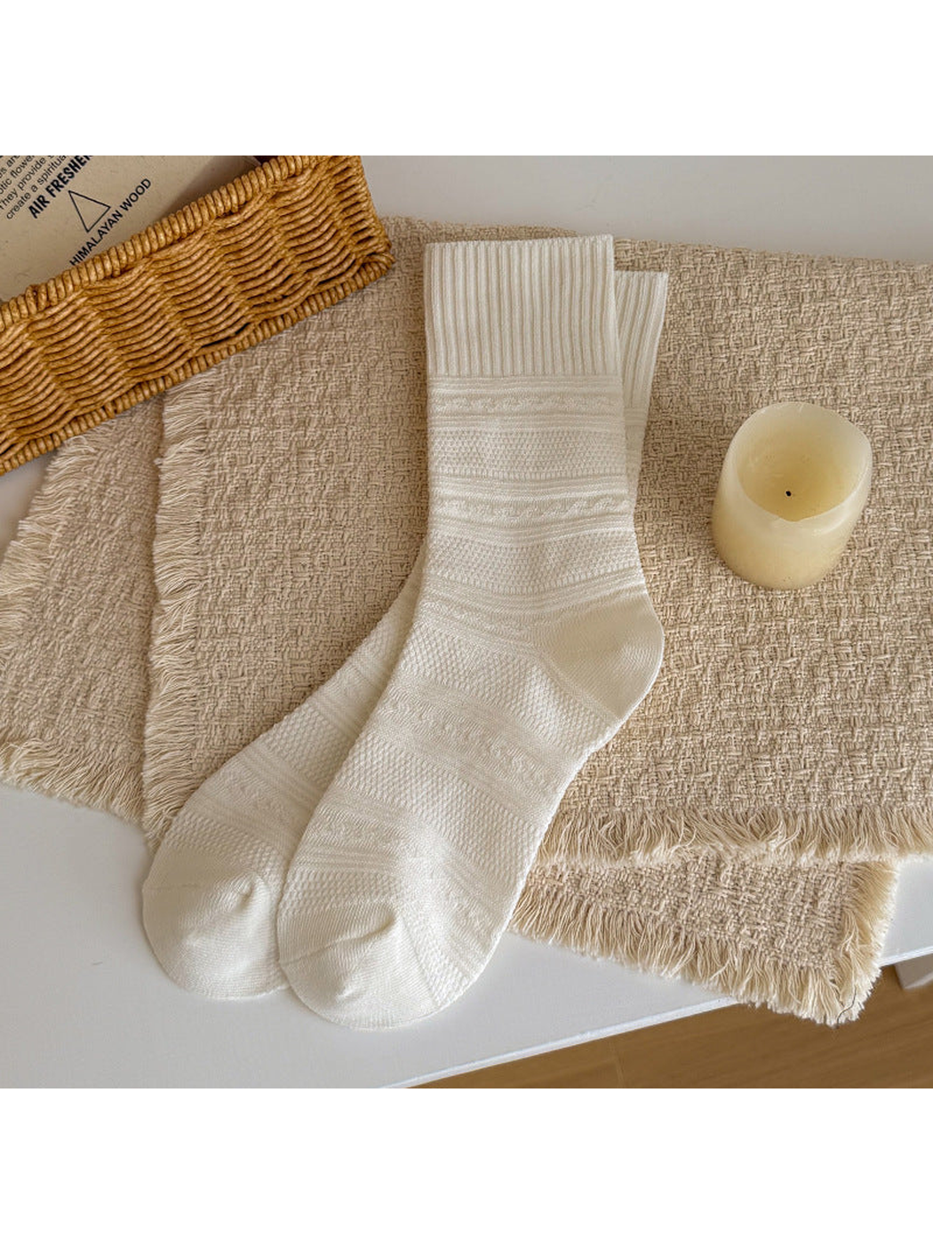 White textured crew socks laid flat