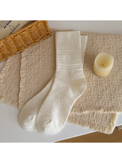 White textured crew socks laid flat