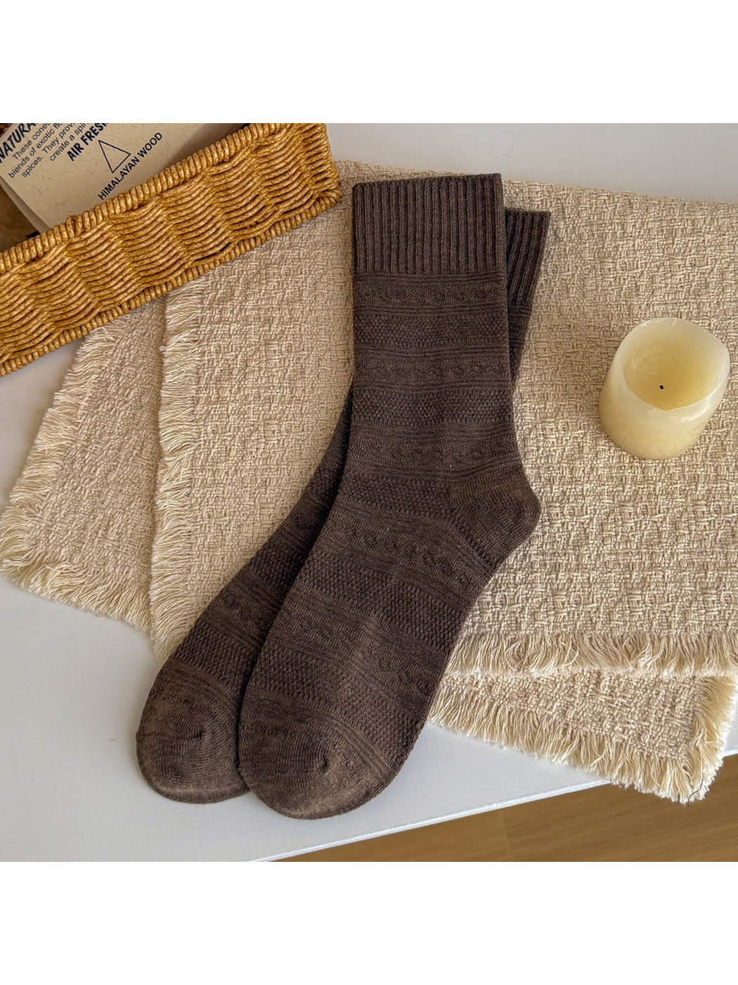Brown textured crew socks laid flat
