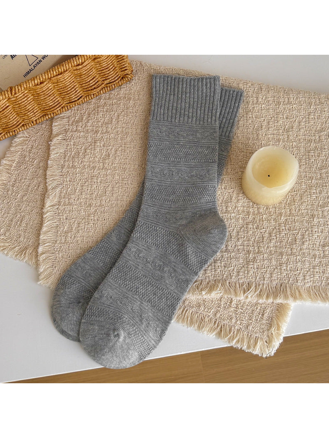 Light gray textured crew socks laid flat