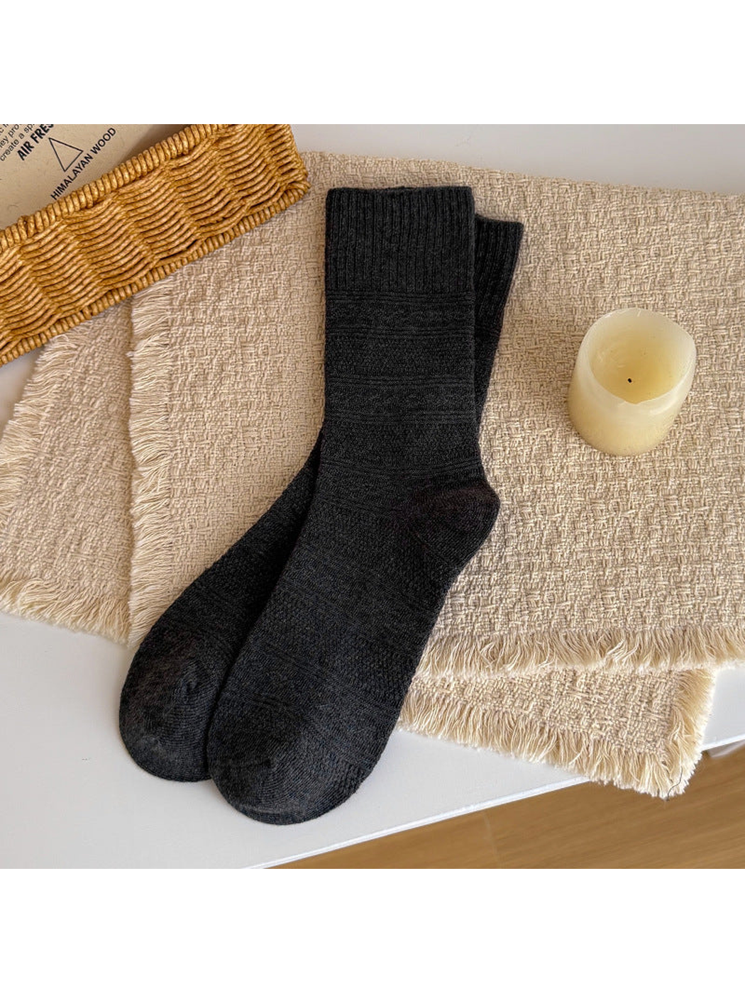 Dark gray textured crew socks laid flat