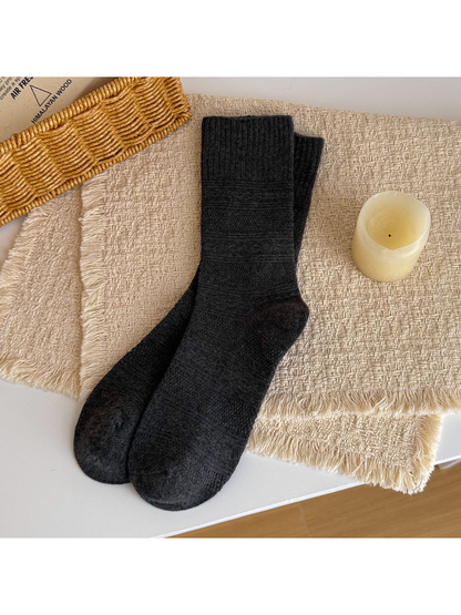 Dark gray textured crew socks laid flat