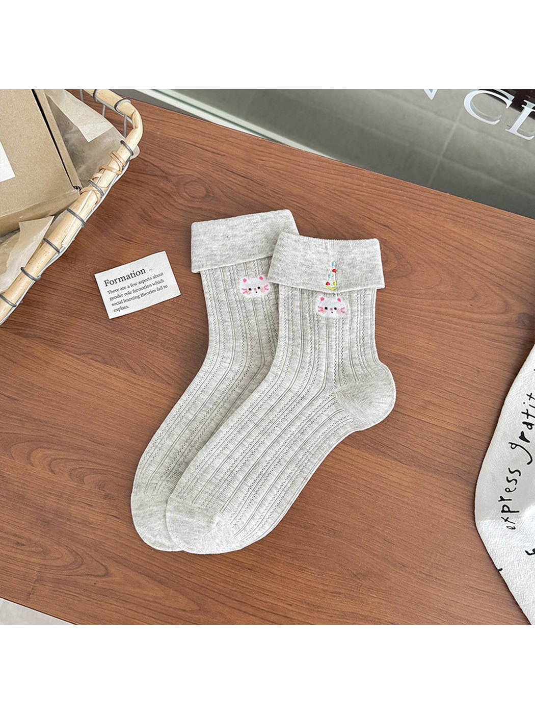 Greige pointelle crew socks with folded cuffs and white cat embroidery