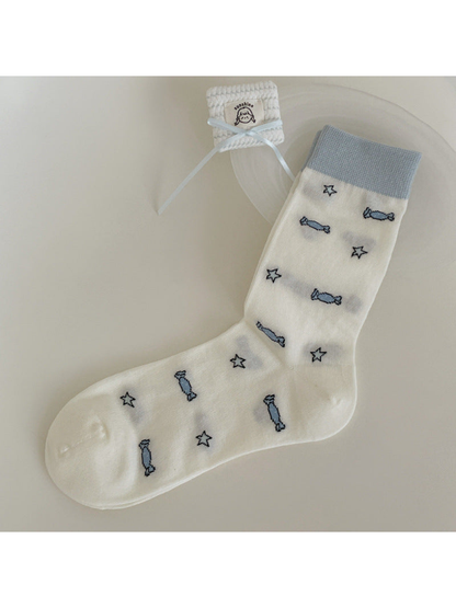 Ivory crew sock with pale blue candy and star motifs