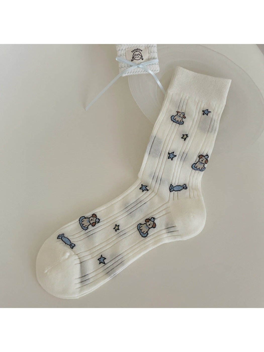 Ivory ribbed crew sock with dog, candy and star motifs