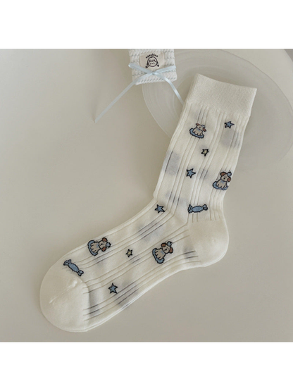 Ivory ribbed crew sock with dog, candy and star motifs