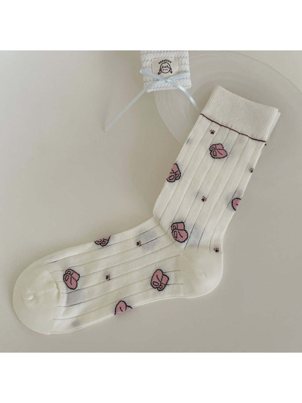 Ivory ribbed crew sock with pink slipper motifs and burgundy cuff trim
