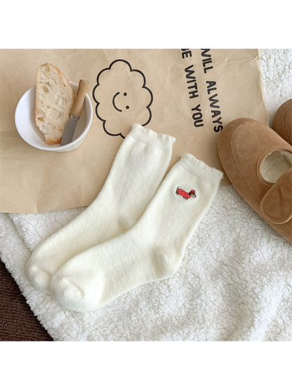 Ivory fuzzy crew socks with red-coated dog embroidery