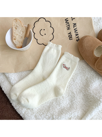 Ivory fuzzy crew socks with red-lettered dog embroidery