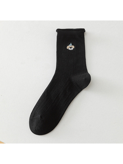 Black crew sock with a blue-cap dog motif, full product view