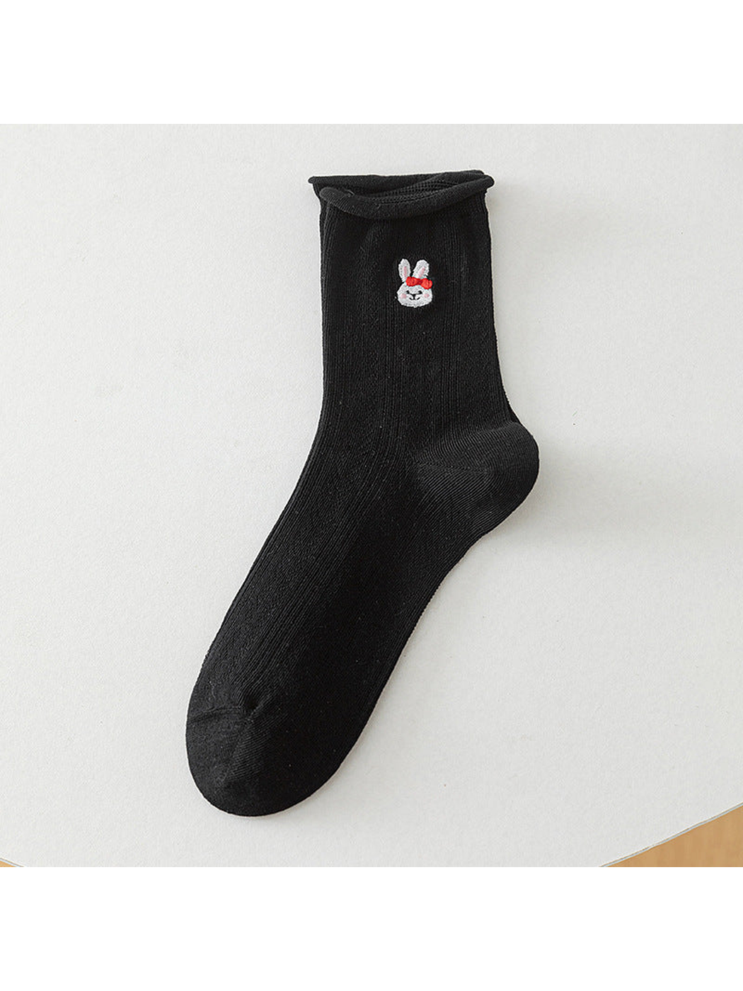 Black crew sock with a red-bow rabbit motif, full product view