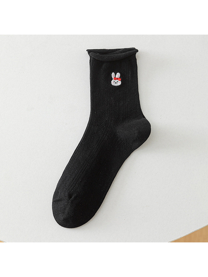 Black crew sock with a red-bow rabbit motif, full product view