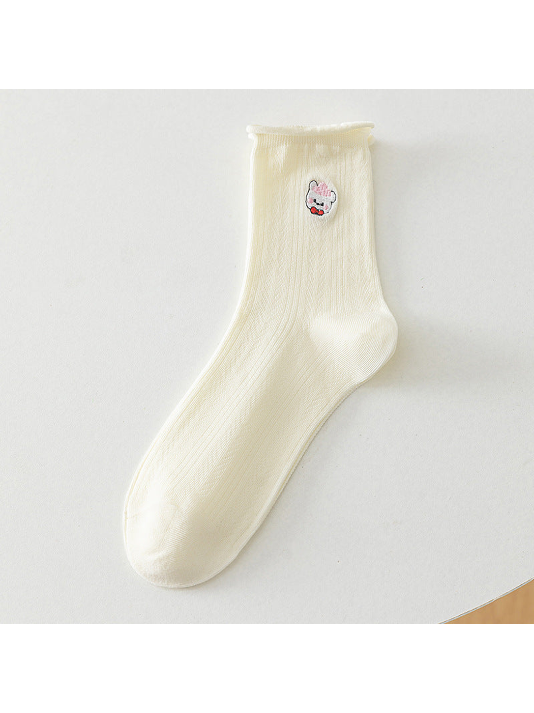 Ivory crew sock with a pink-cap bear motif, full product view