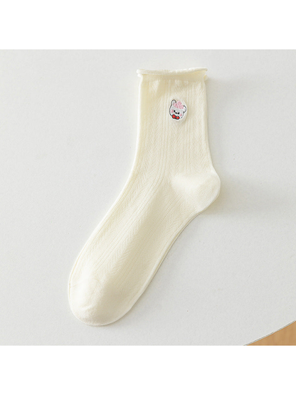 Ivory crew sock with a pink-cap bear motif, full product view
