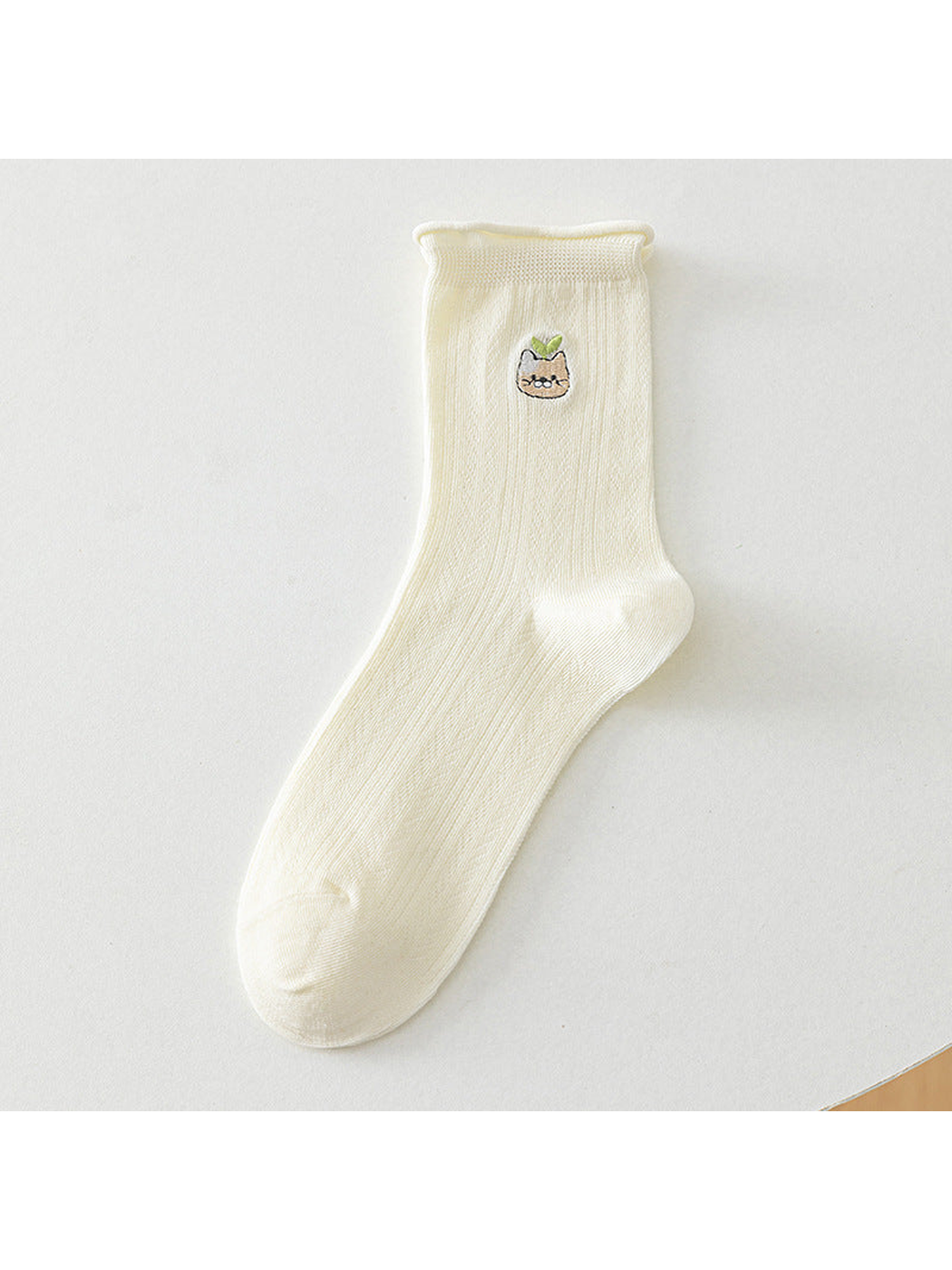 Ivory crew sock with a green-leaf cat motif, full product view