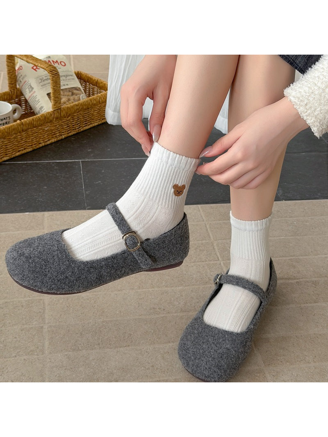 White bear-motif ankle socks worn with gray strap shoes