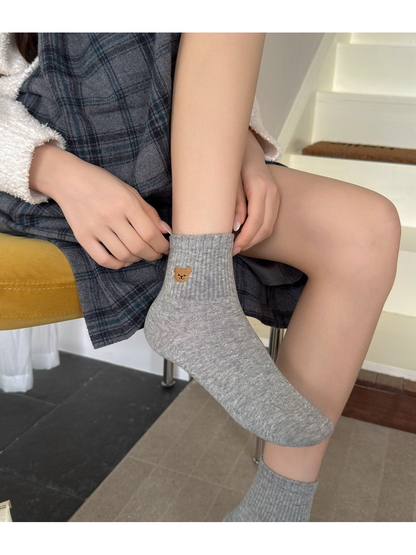 Light gray bear-motif ankle sock shown fully while worn