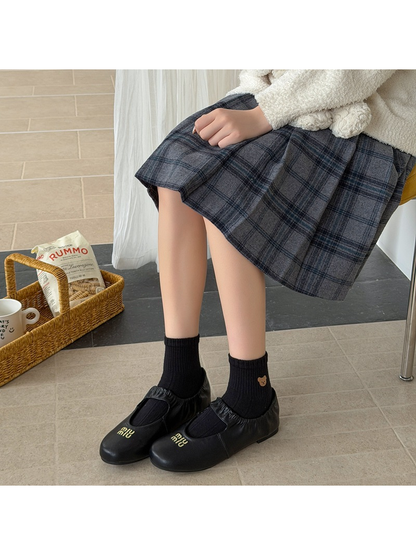 Black bear-motif ankle socks styled with black flats