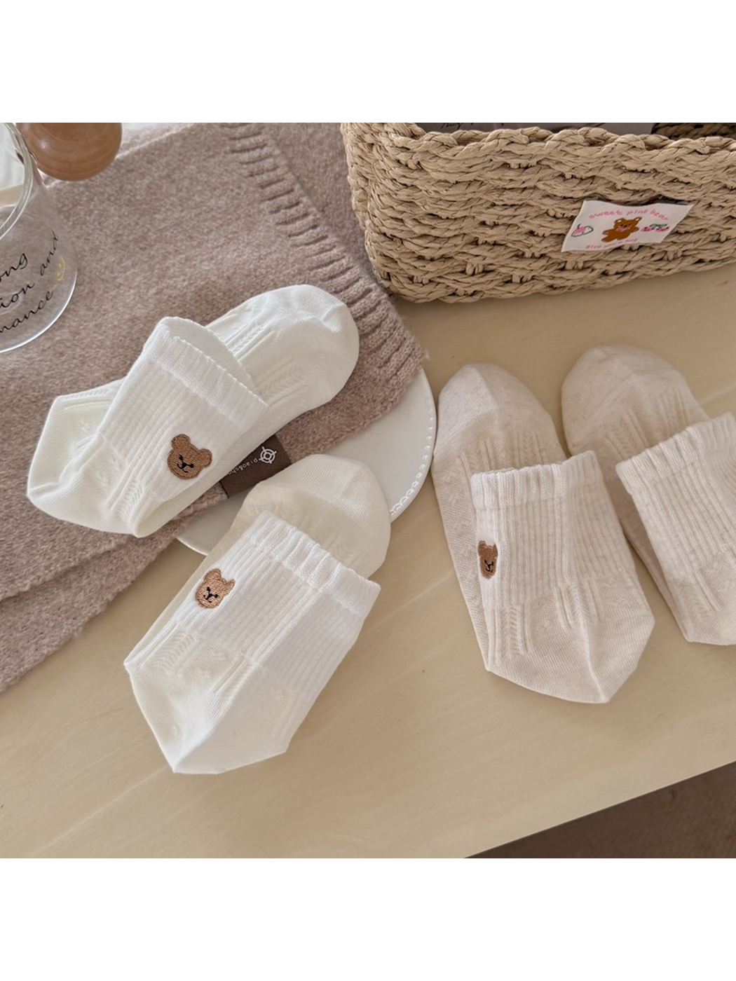 Assorted bear-motif ankle socks arranged on a tabletop