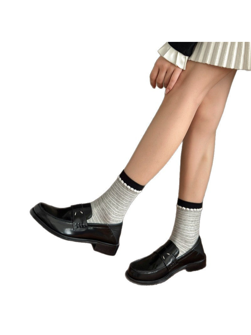 Gray finely striped crew socks styled with black loafers