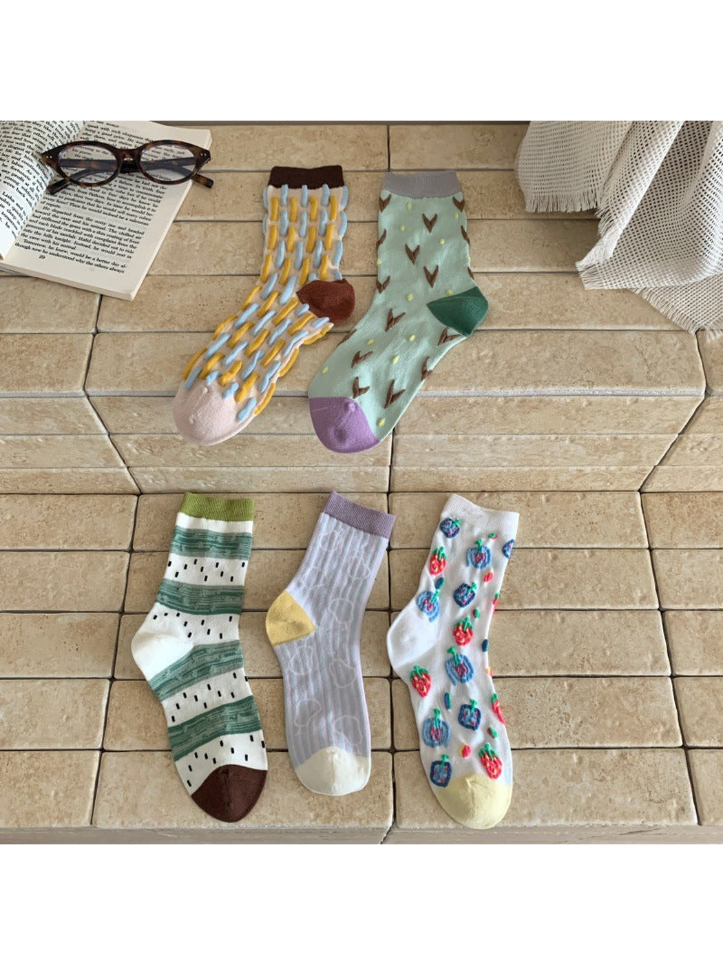 Five patterned crew sock designs displayed together