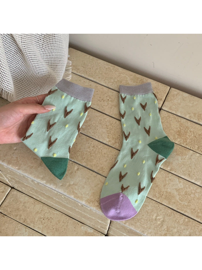 Mint crew socks with brown V motifs and yellow dots