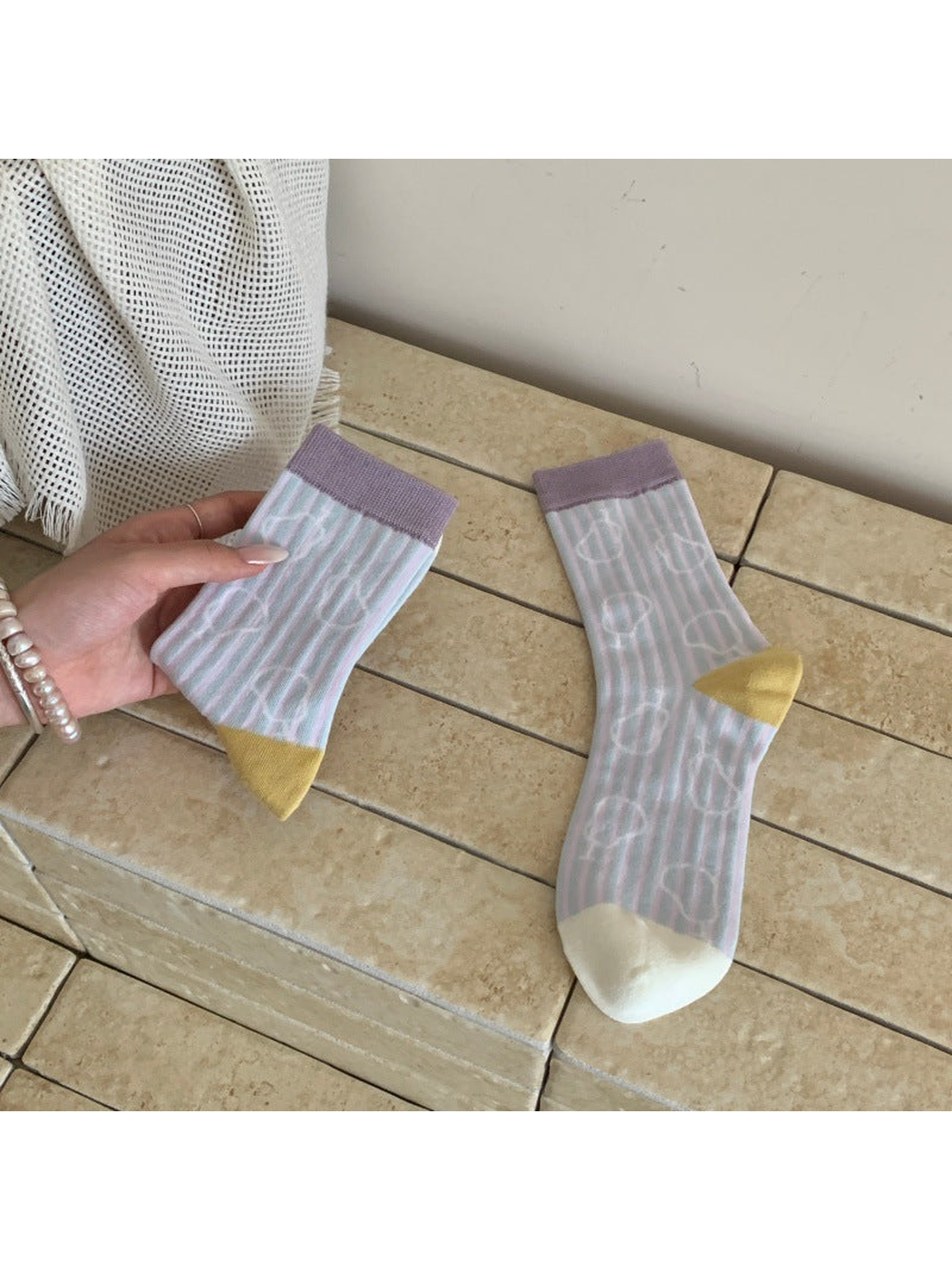 Pastel striped crew socks with outlined pear motifs