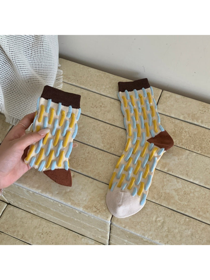 Cream crew socks with raised blue and yellow dash rows