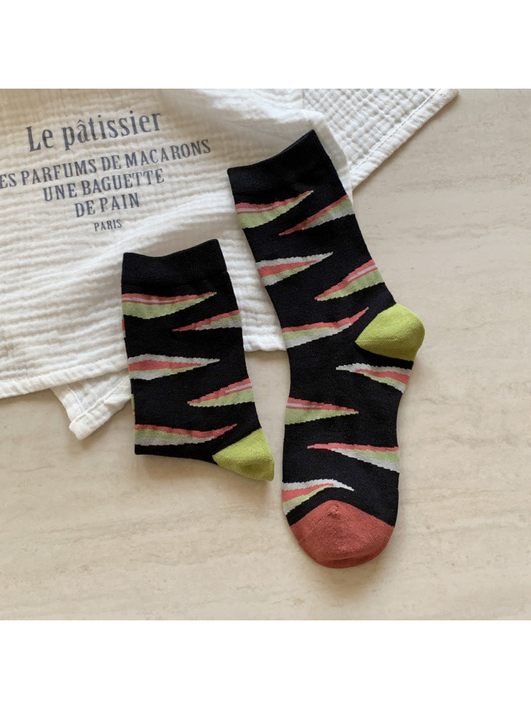 Black crew socks with colorful jagged stripes