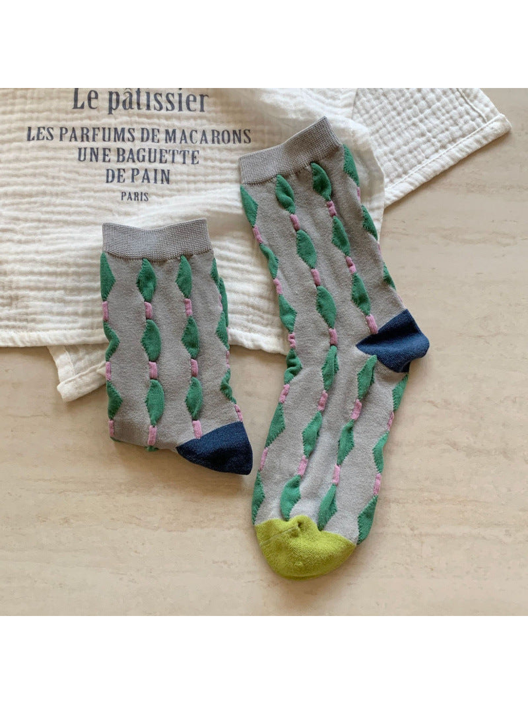 Light gray crew socks with raised green diamond columns