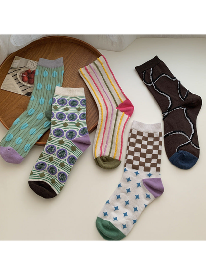 Five patterned crew sock styles displayed together