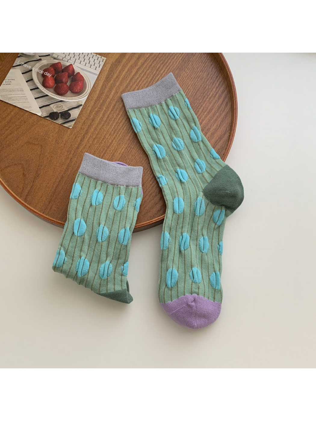 Green crew socks with raised turquoise dots and purple toes