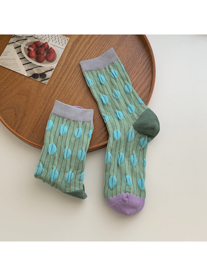 Green crew socks with raised turquoise dots and purple toes