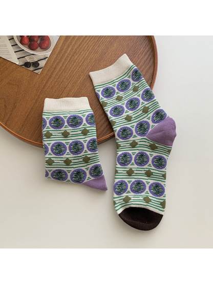 Striped crew socks with purple circles, olive diamonds and brown toes