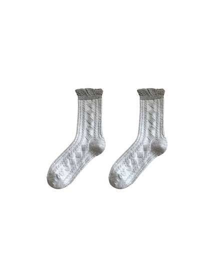 Light gray crew socks with raised diamond pattern and ruffled cuffs