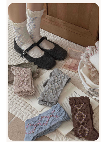 Floral argyle socks arranged with shoes and accessories