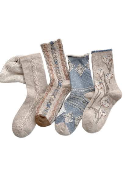 Four patterned crew sock styles on a white background