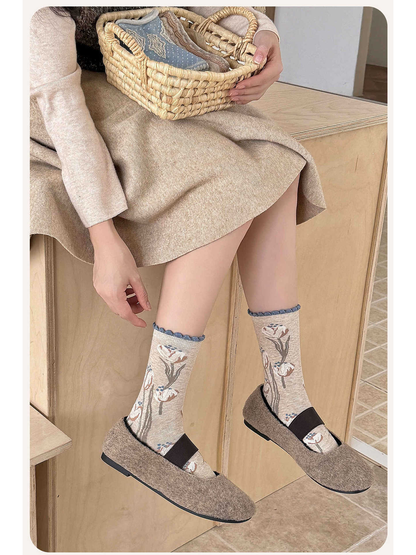 Tulip-pattern crew socks styled with taupe flats
