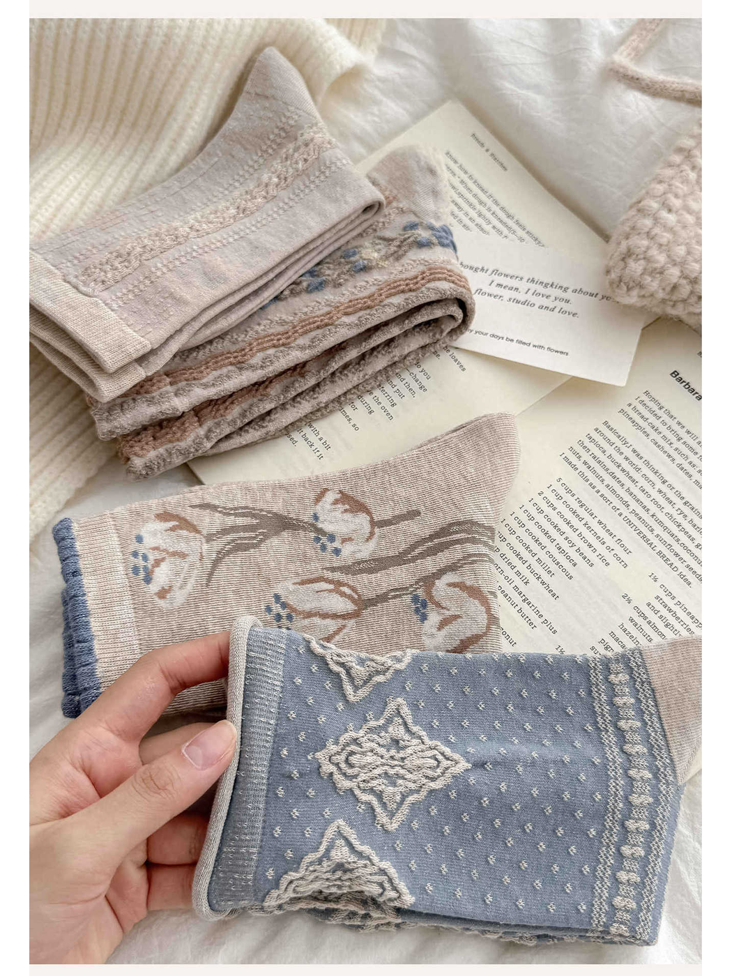 Close-up of folded floral and diamond-pattern crew socks
