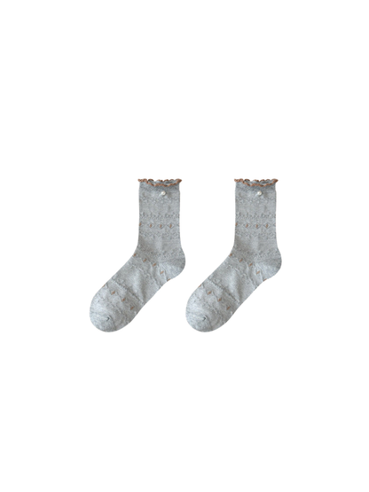 Heather gray ruffled pointelle crew socks with pearl-look accents