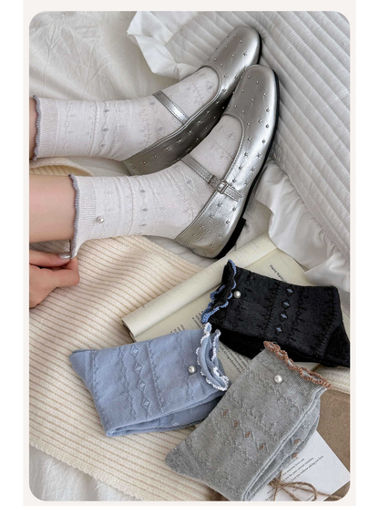 White pointelle socks worn with silver shoes beside folded color variants