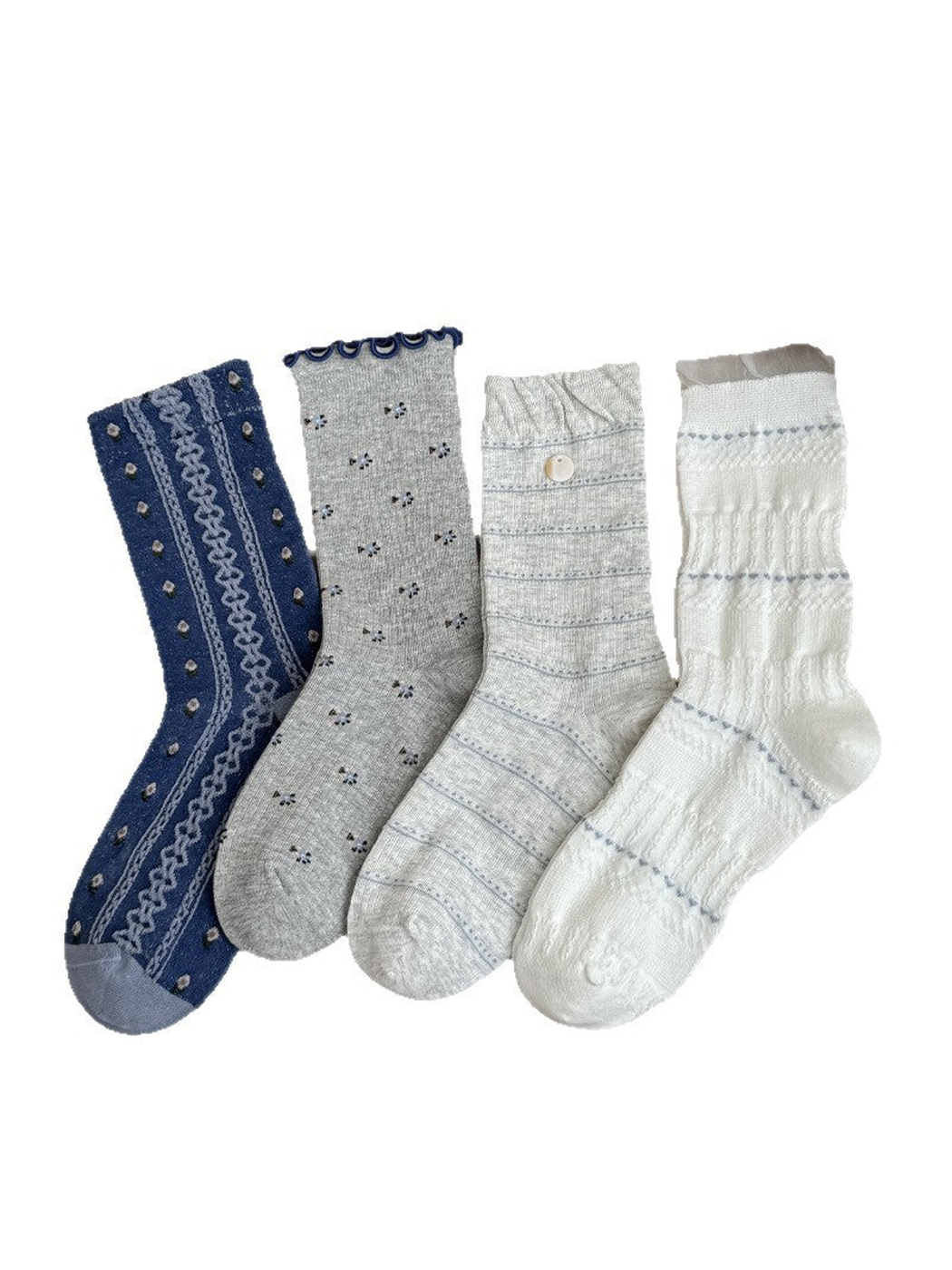 Four crew sock styles in blue, gray and white displayed together