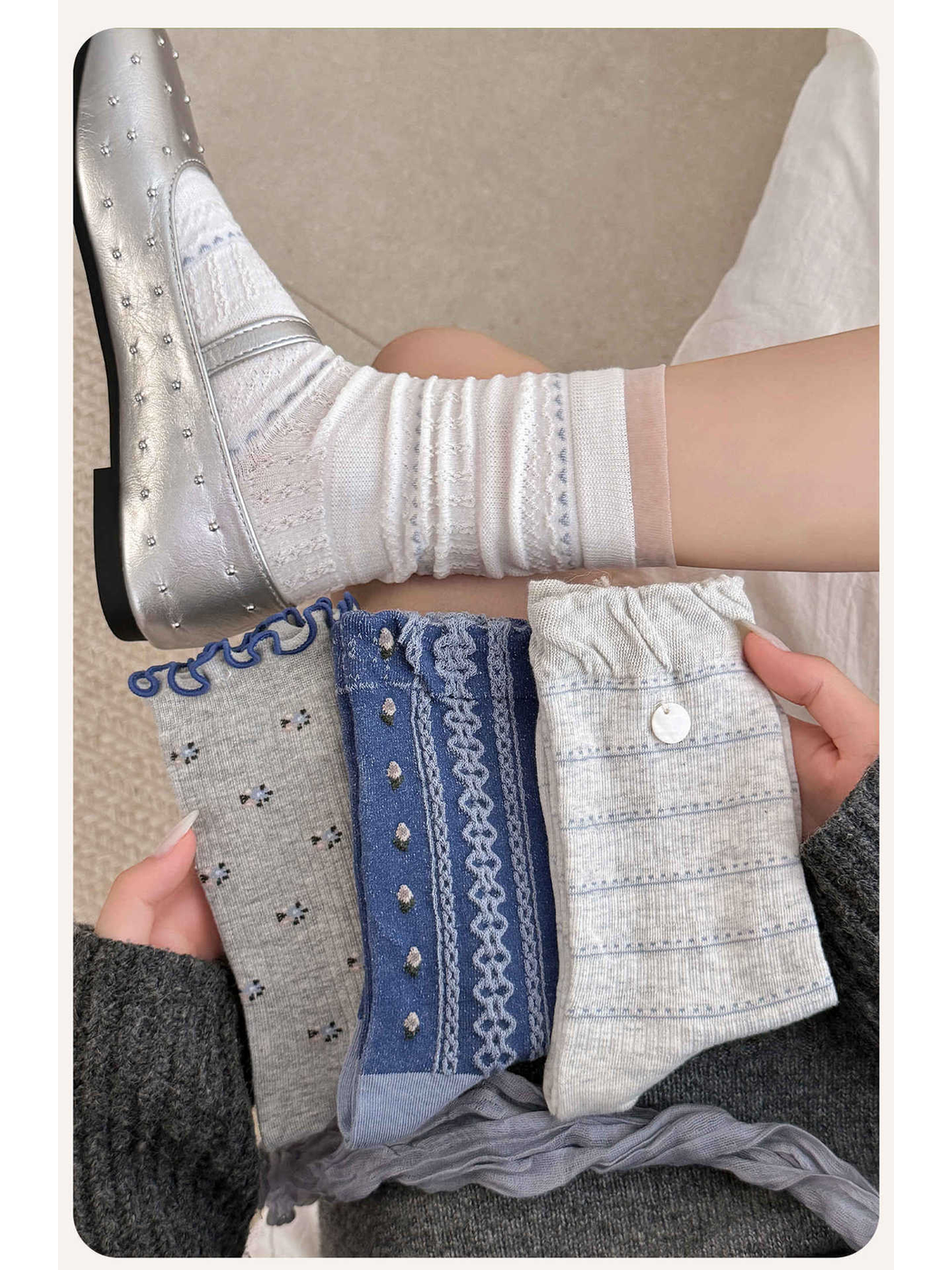 White socks worn with a silver flat beside three folded sock styles