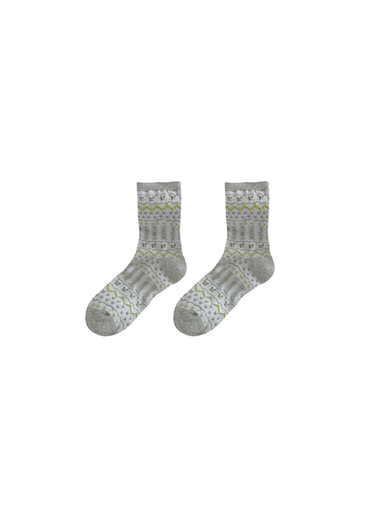 Light gray crew socks with geometric waves, floral motifs and textured panels