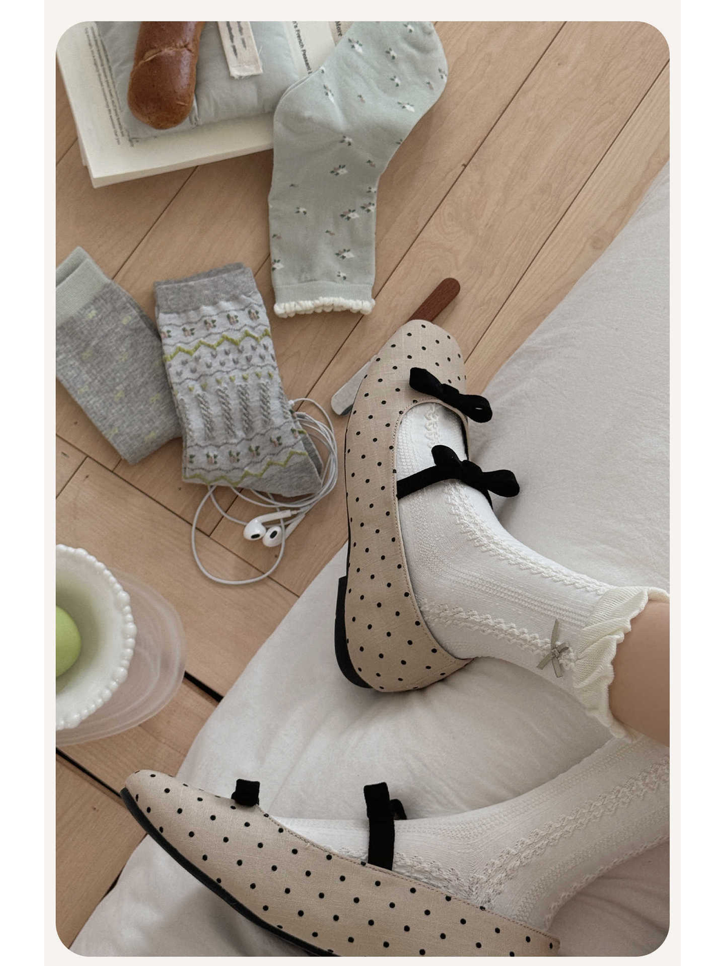 Ivory openwork crew socks styled with polka-dot flats