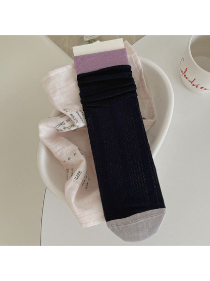 Navy ribbed crew sock with light purple cuff and light gray toe