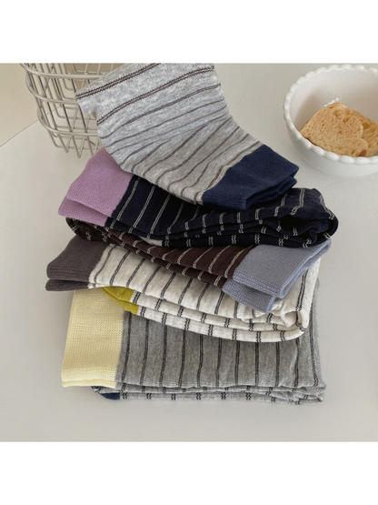 Assorted striped crew socks with contrasting cuffs and toes