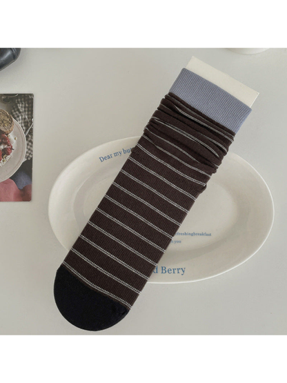Brown striped crew sock with light blue cuff and black toe