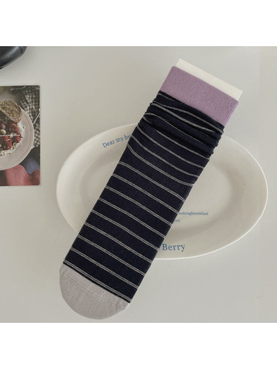 Navy striped crew sock with lavender cuff and light gray toe