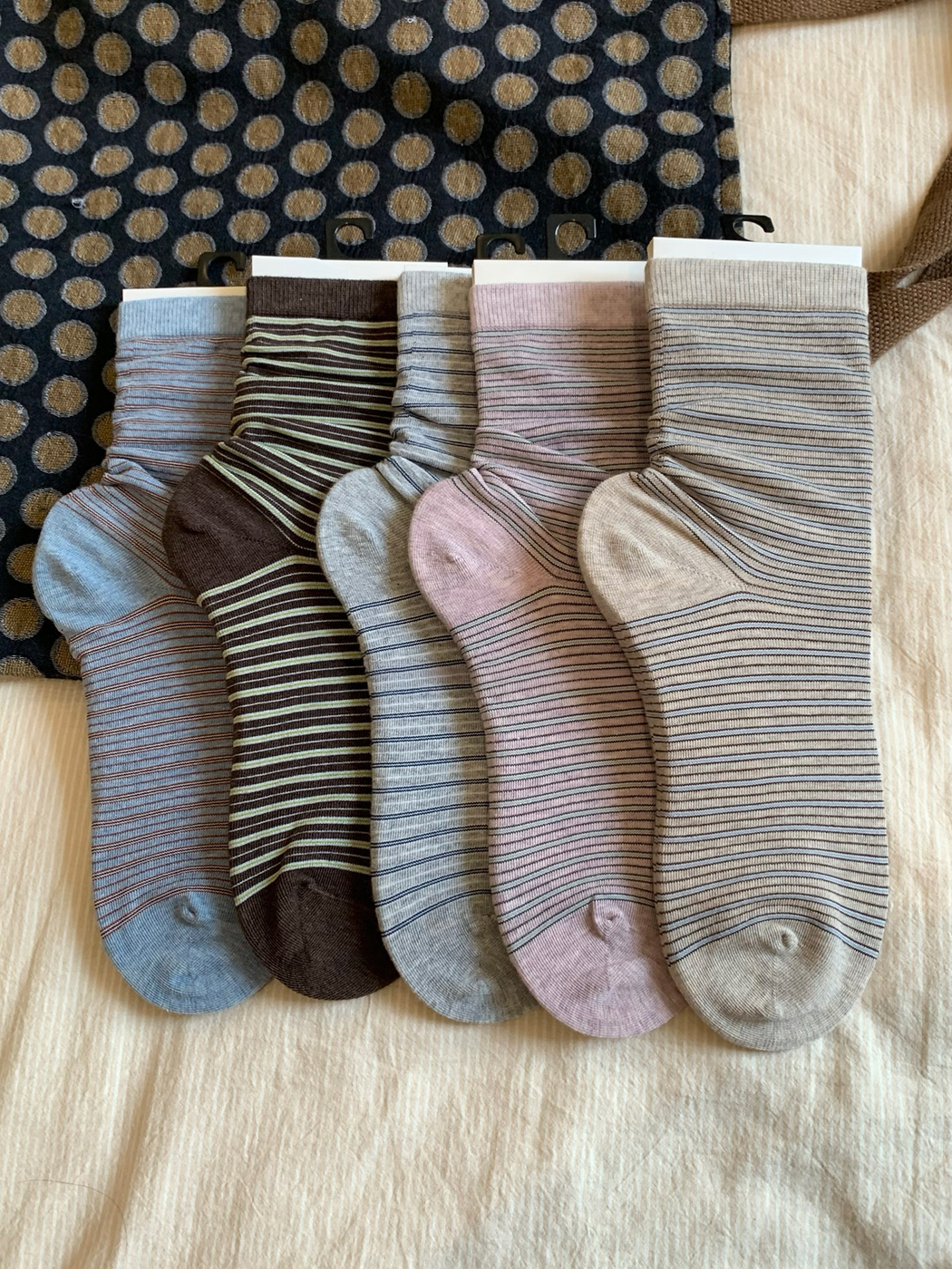 Five striped crew sock colors displayed together